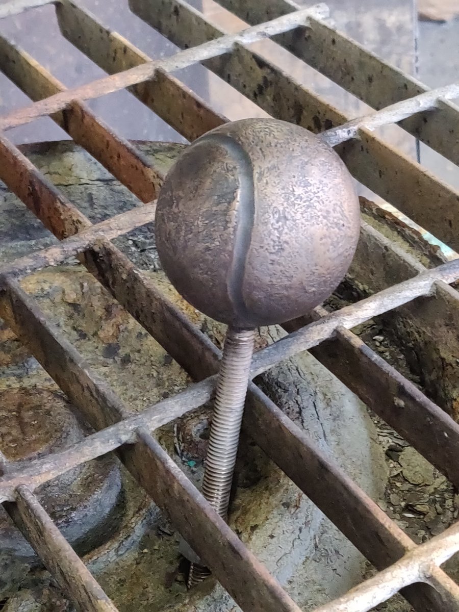 Bronze tennis ball from Flat-coated Retriever sculpture