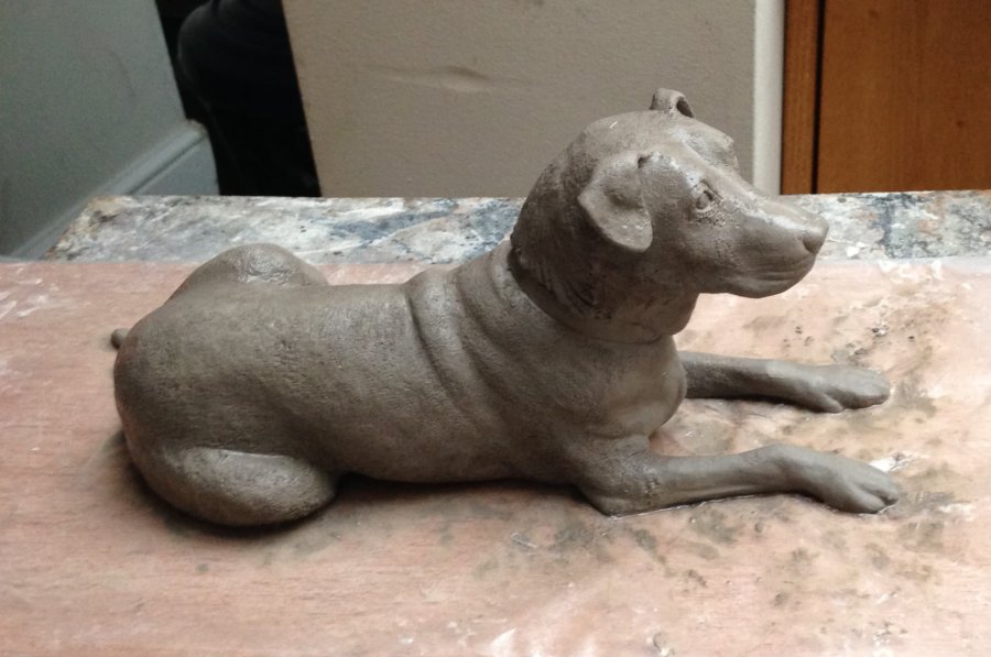 A clay sculpture of a dog