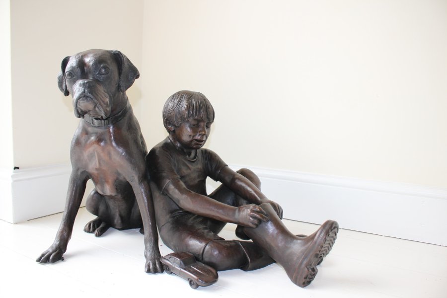 Boy and Boxer Dog bronze sculpture