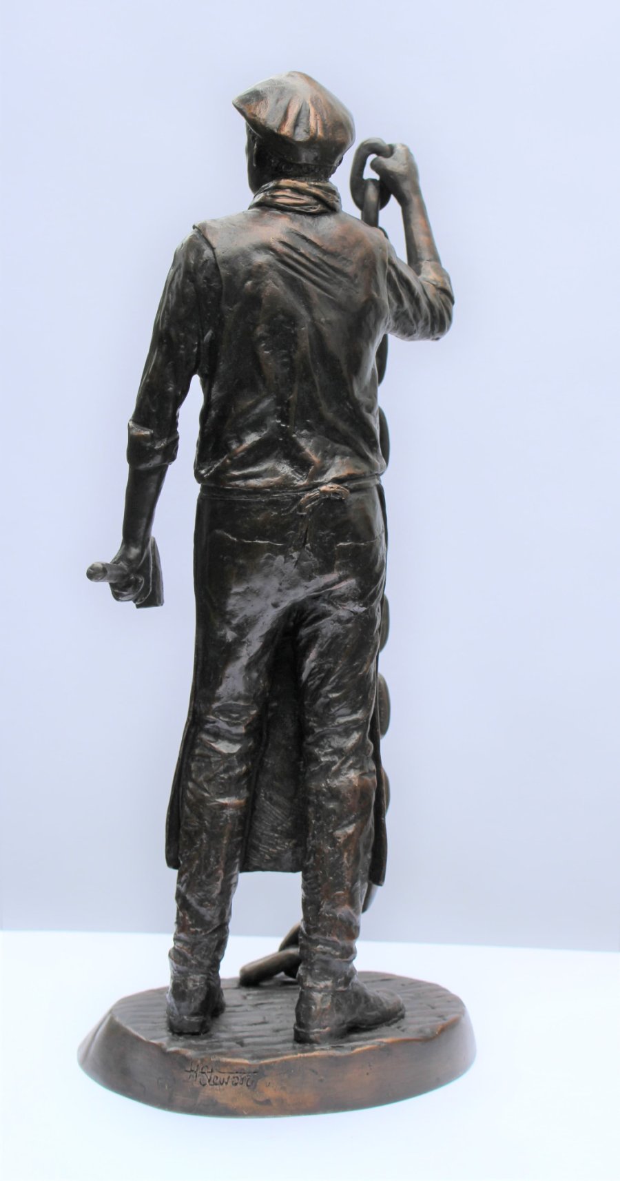 Chain Maker bronze sculpture from the back