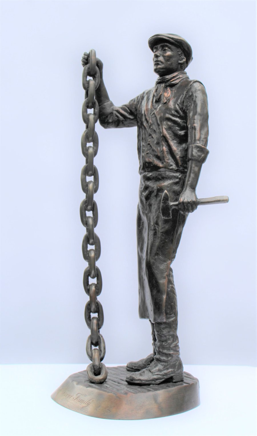 Chain Maker bronze sculpture from the side
