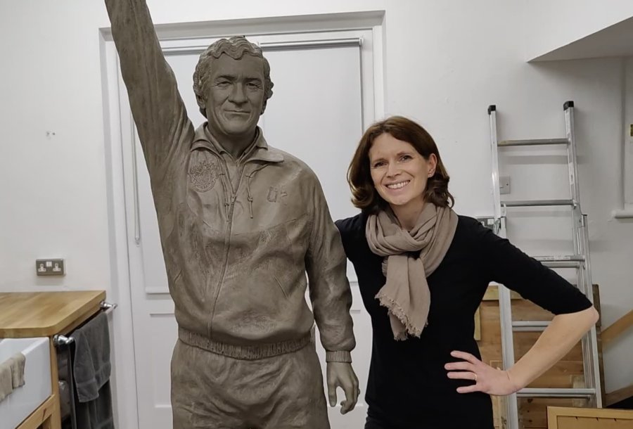 Hannah Stewart sculptor with Danny Bergara clay sculpture
