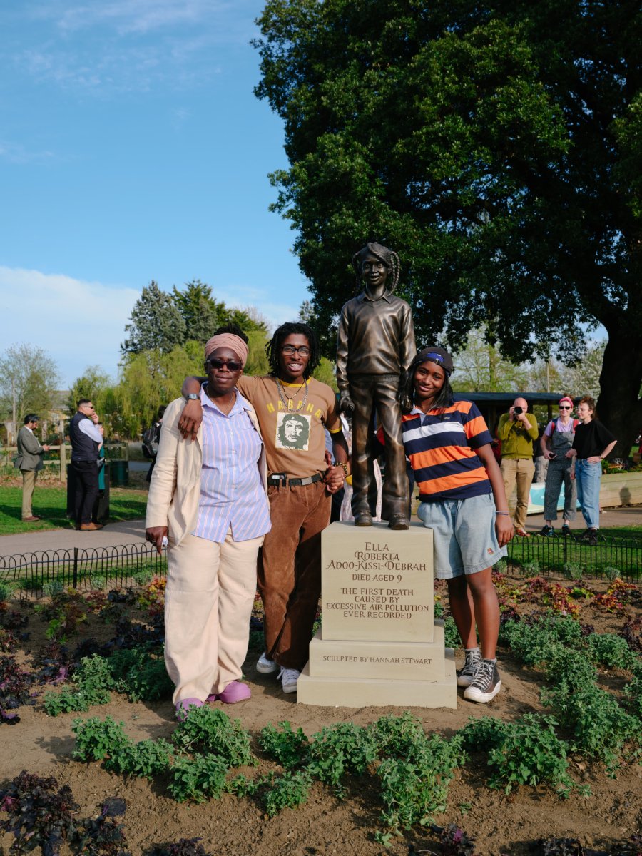 The family of Ella Roberta Adoo-Kissi-Debrah bronze next to the statue of Ella