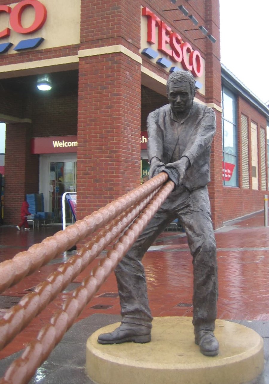 Hauling Man, life size bronze sculpture