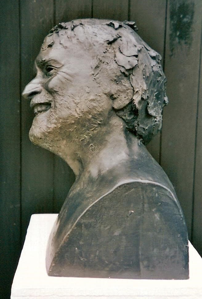 Life size bronze portrait bust of a laughing man