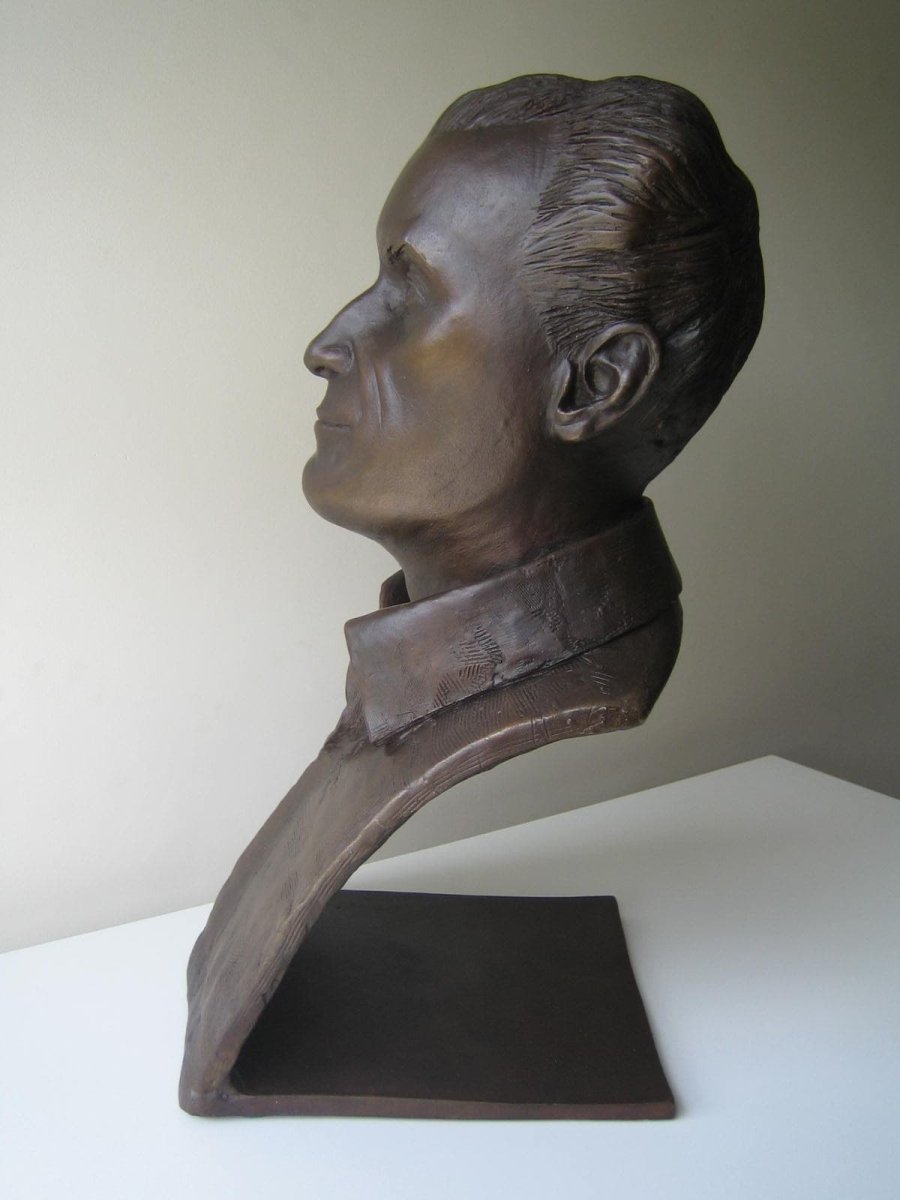 Profile view of Len Bates bronze portrait bust