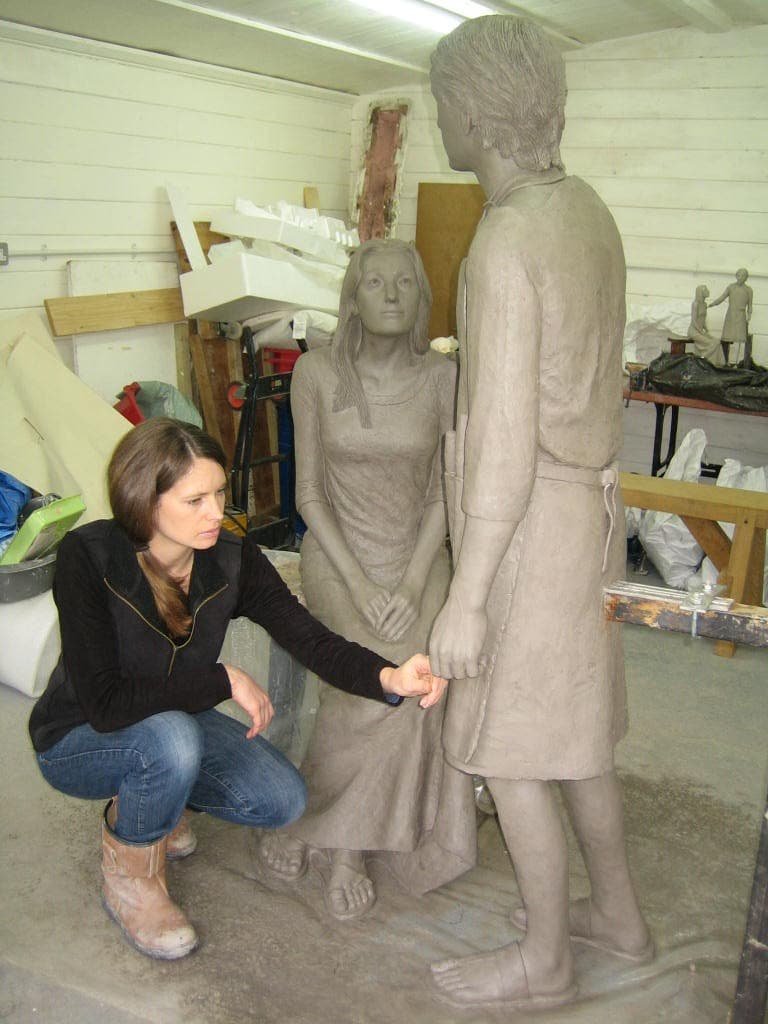 Hannah Stewart working on the clay sculpture of Mary and Jesus