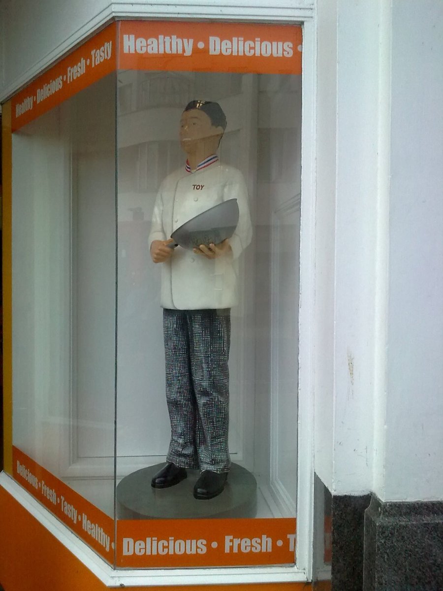 Mr Toy figure in shop window