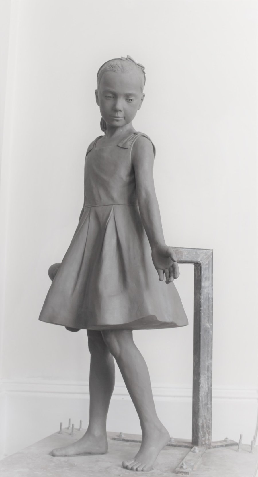 Life size clay sculpture of a young girl