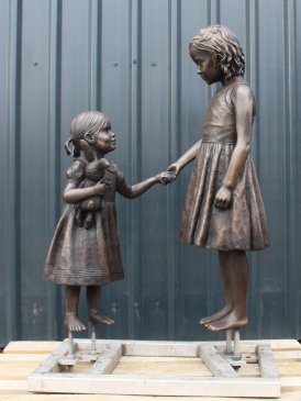Two Sisters Holding Hands