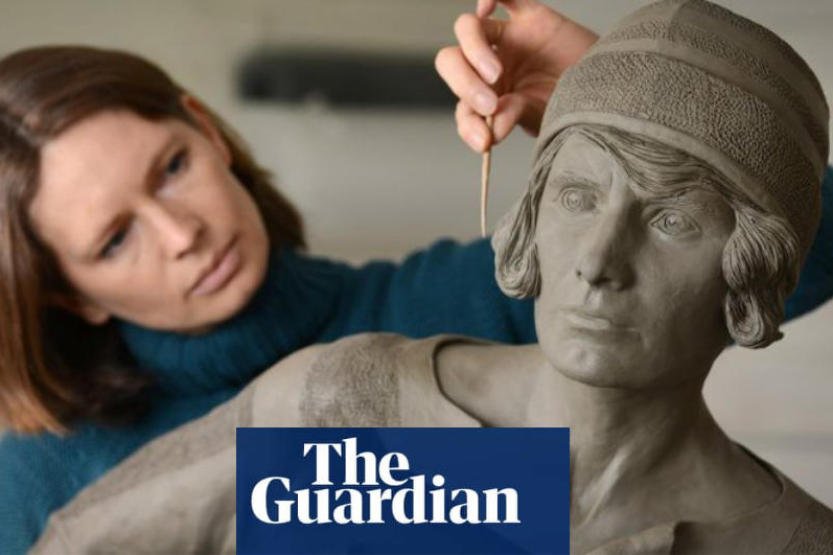 Hannah working on Lily Parr sculpture with Guardian logo