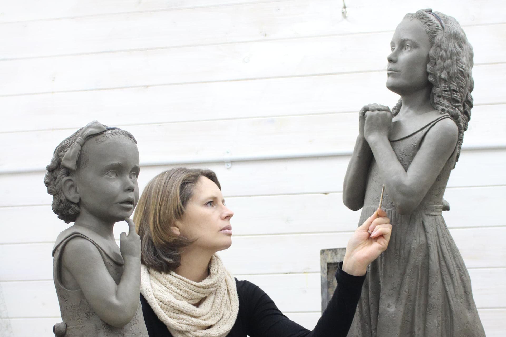 Hannah Stewart working on Two Sisters sculpture